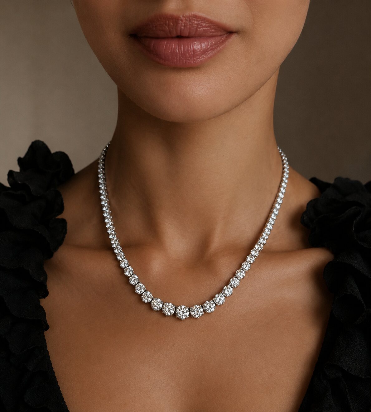 Model wearing a graduated diamond rivière necklace